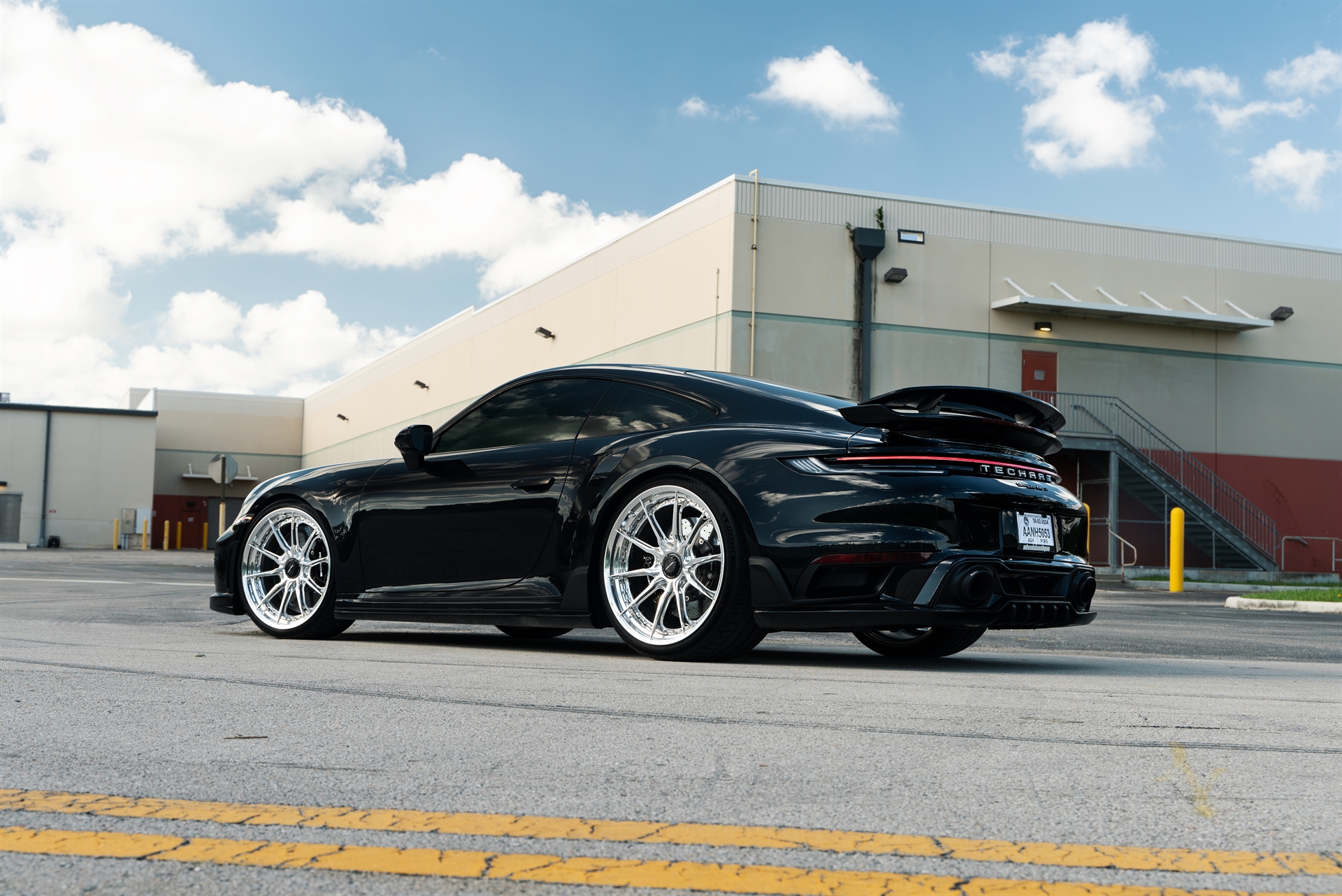Porsche 992 Turbo S | Jet Black Metallic | on HRE S104SC | Polished Clear | Techart Aero Kit